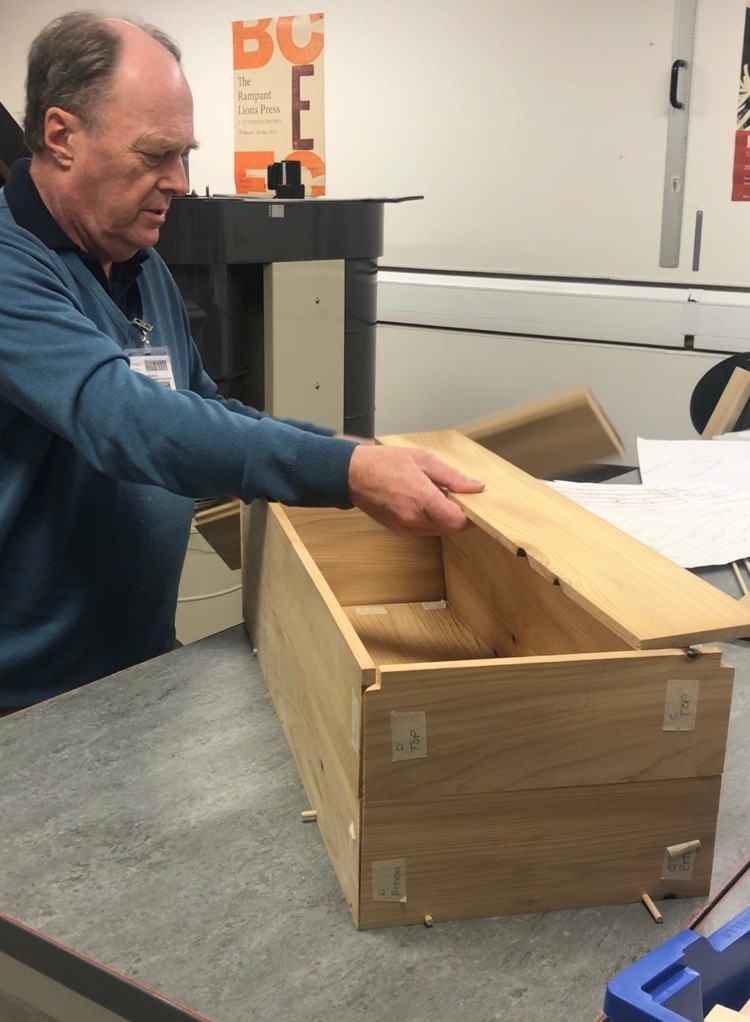Right: Dr Geoffrey Killen, expert in ancient Egyptian carpentry, assembling the 1:1 scale craft replica of the dog box coffin. Photo: Melanie Pitkin